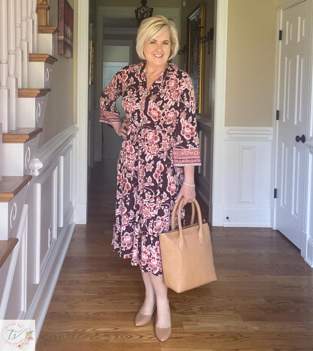 Over 40 Fashion Blogger, Tania Stephens is ready for a fall wedding wearing this muted floral print midi dress