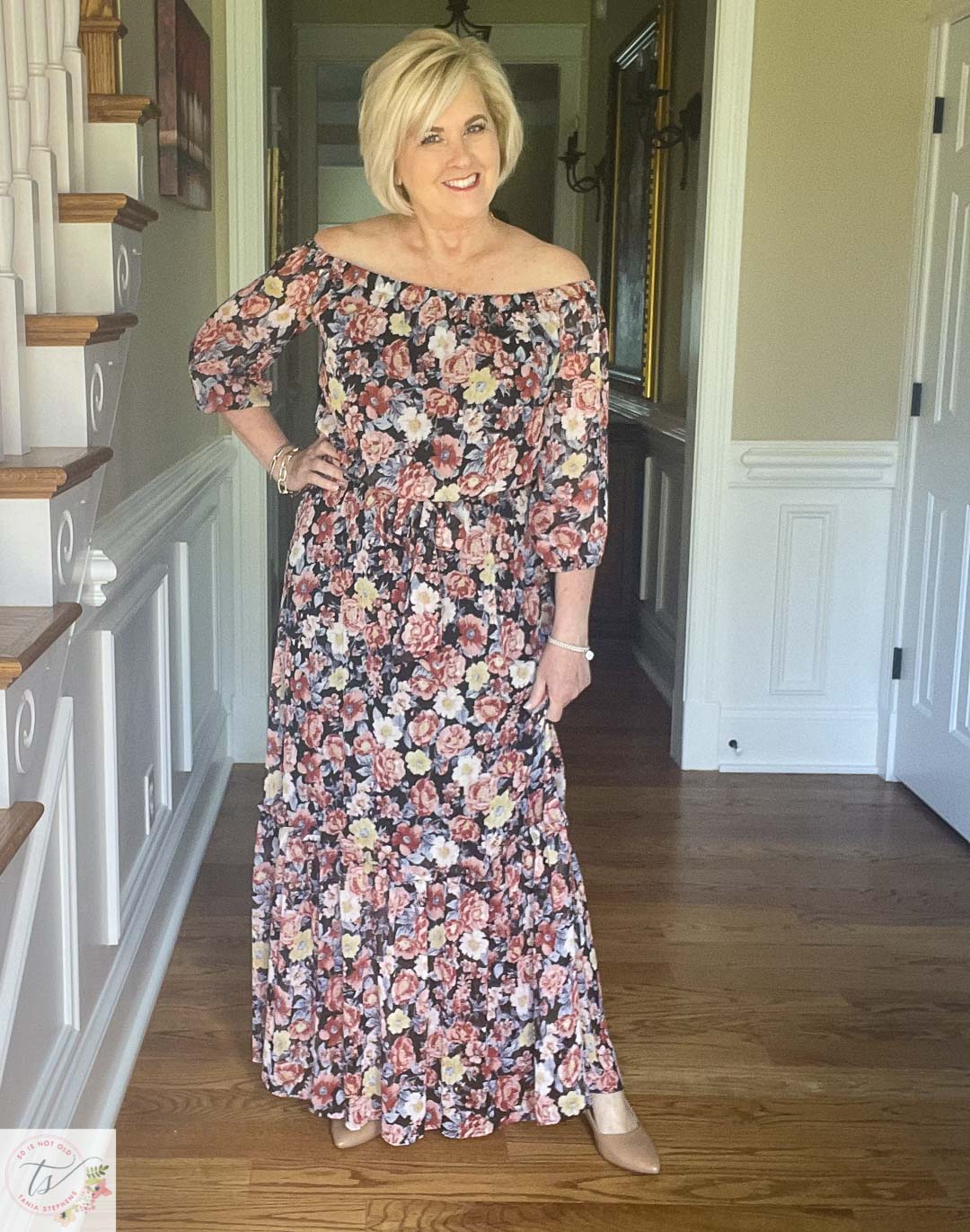 Over 40 Fashion Blogger, Tania Stephens is ready for a fall wedding wearing this off the shoulder floral print maxi dress