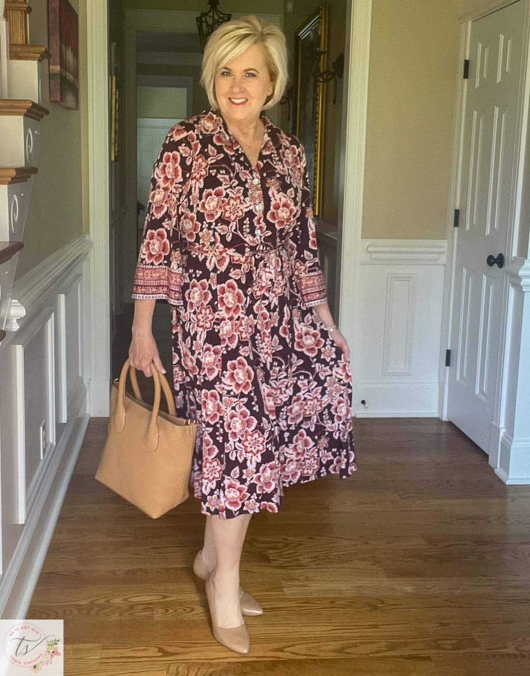 Over 40 Fashion Blogger, Tania Stephens is ready for a fall wedding wearing this muted fall floral print midi dress