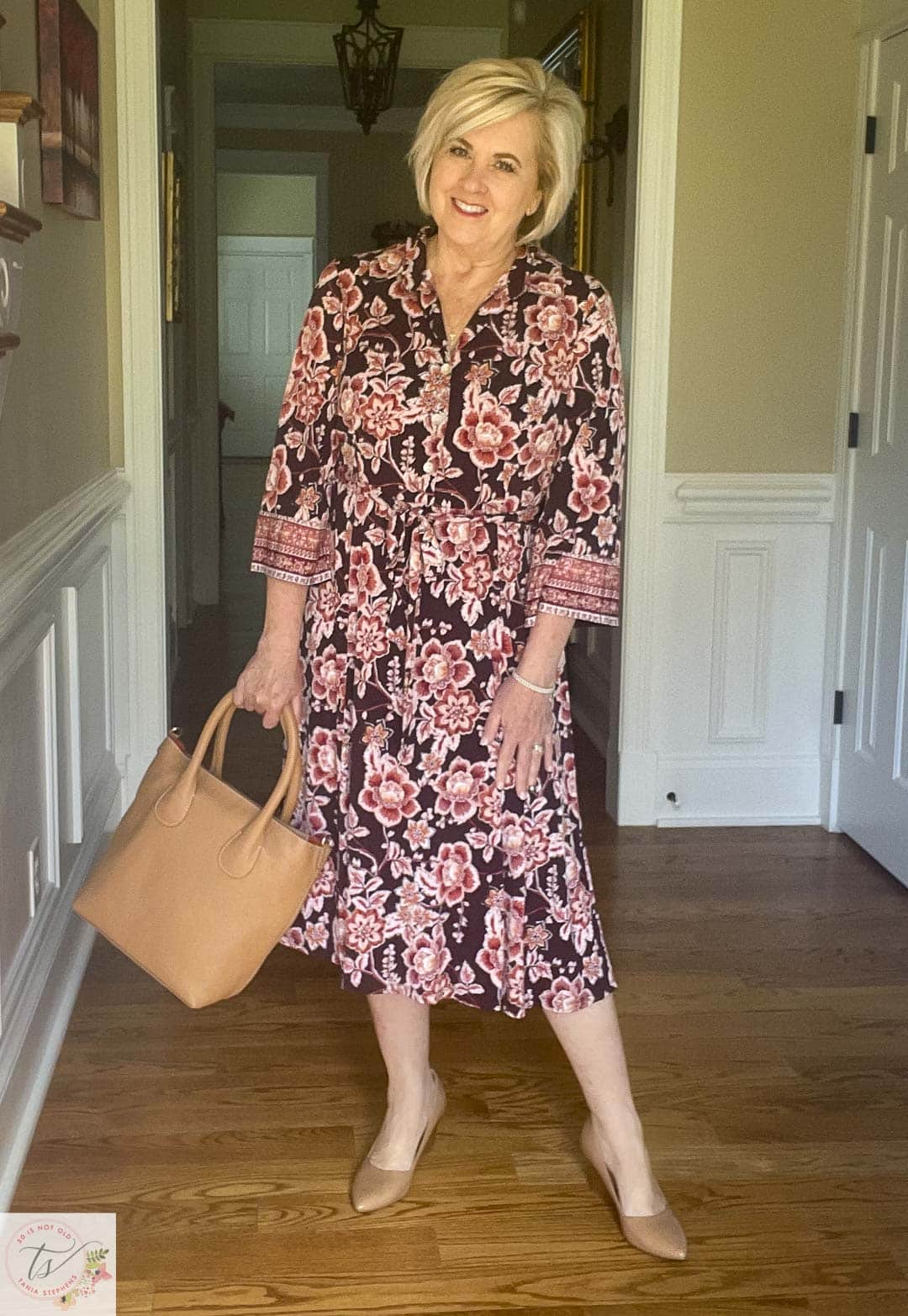Over 40 Fashion Blogger, Tania Stephens is ready for a fall wedding wearing this fall floral print midi dress