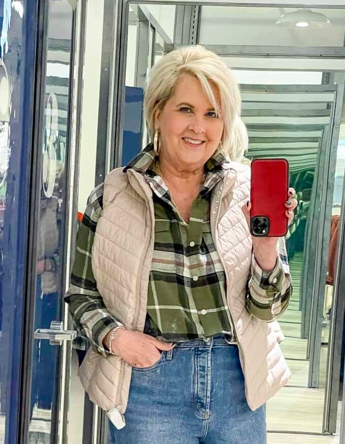 Over 40 Fashion Blogger, Tania Stephens, is doing a try on at Old Navy wearing plaid flannel shirt and a puffer vest