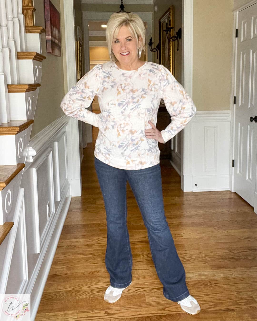 Over 40 fashion blogger, Tania Stephens is wearing 1 of 4 sweatshirts with a pair of jeans, including this floral one from Kohls