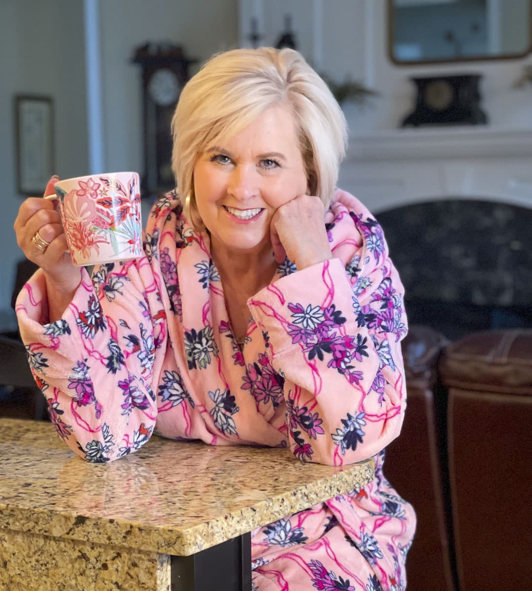 Over 40 fashion blogger, Tania Stephens is staying snuggly warm on cold rainy mornings in a robe in the Hope Blooms Pink print from Vera Bradley