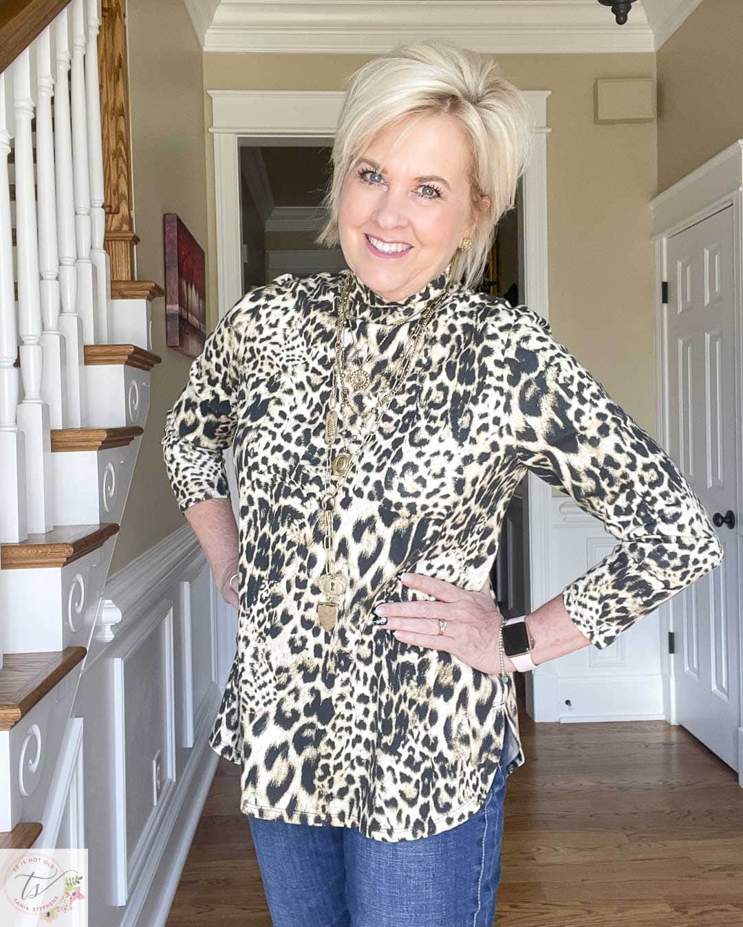 Over 40 Fashion Blogger, Tania Stephens is wearing a jaguar print tunic with a multi-strand necklace