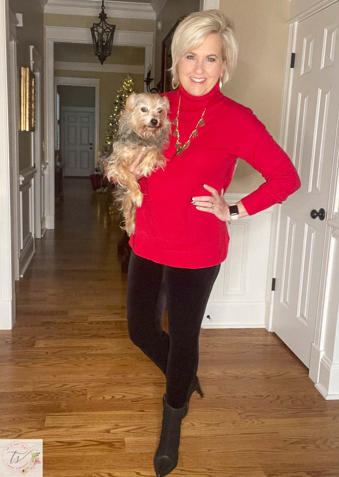 Over 40 Fashion Blogger, Tania Stephens, is celebrating the holidays at home in a red cashmere turtleneck sweater, black velvet leggings from Spanx, and black boots