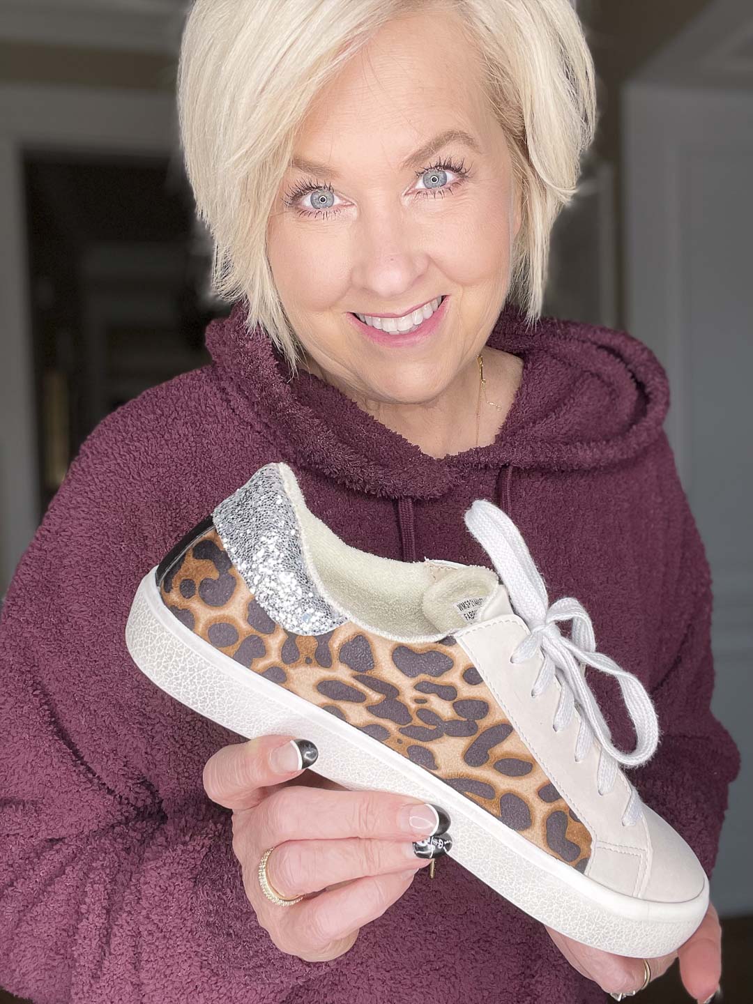 Over 40 Fashion Blogger, Tania Stephens is showing leopard print sneakers with silver on the back