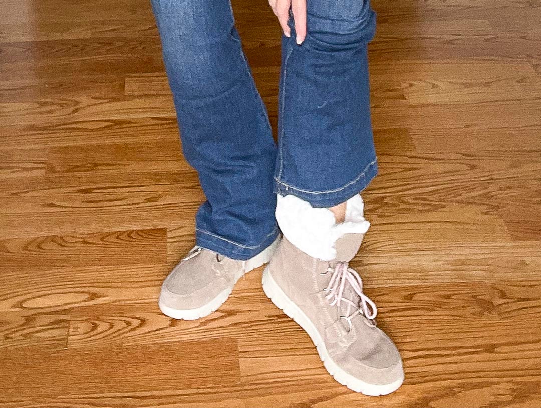 Over 40 Fashion Blogger, Tania Stephens is wearing suede ankle boots with faux-fur trim