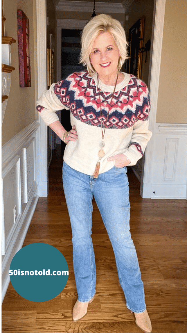 Over 40 Fashion Blogger, 50isnotold is wearing a sweater and jeans look with pointy toe boots