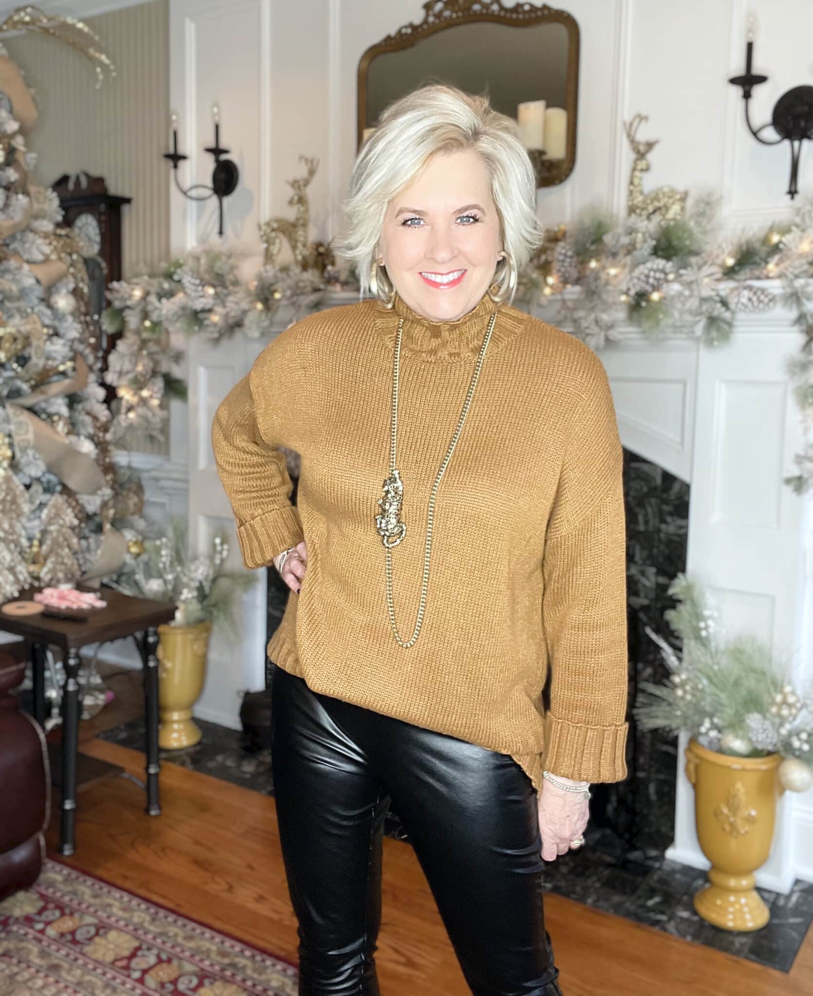 Over 40 Fashion Blogger, Tania Stephens is wearing a turtleneck camel sweater with a leopard necklace