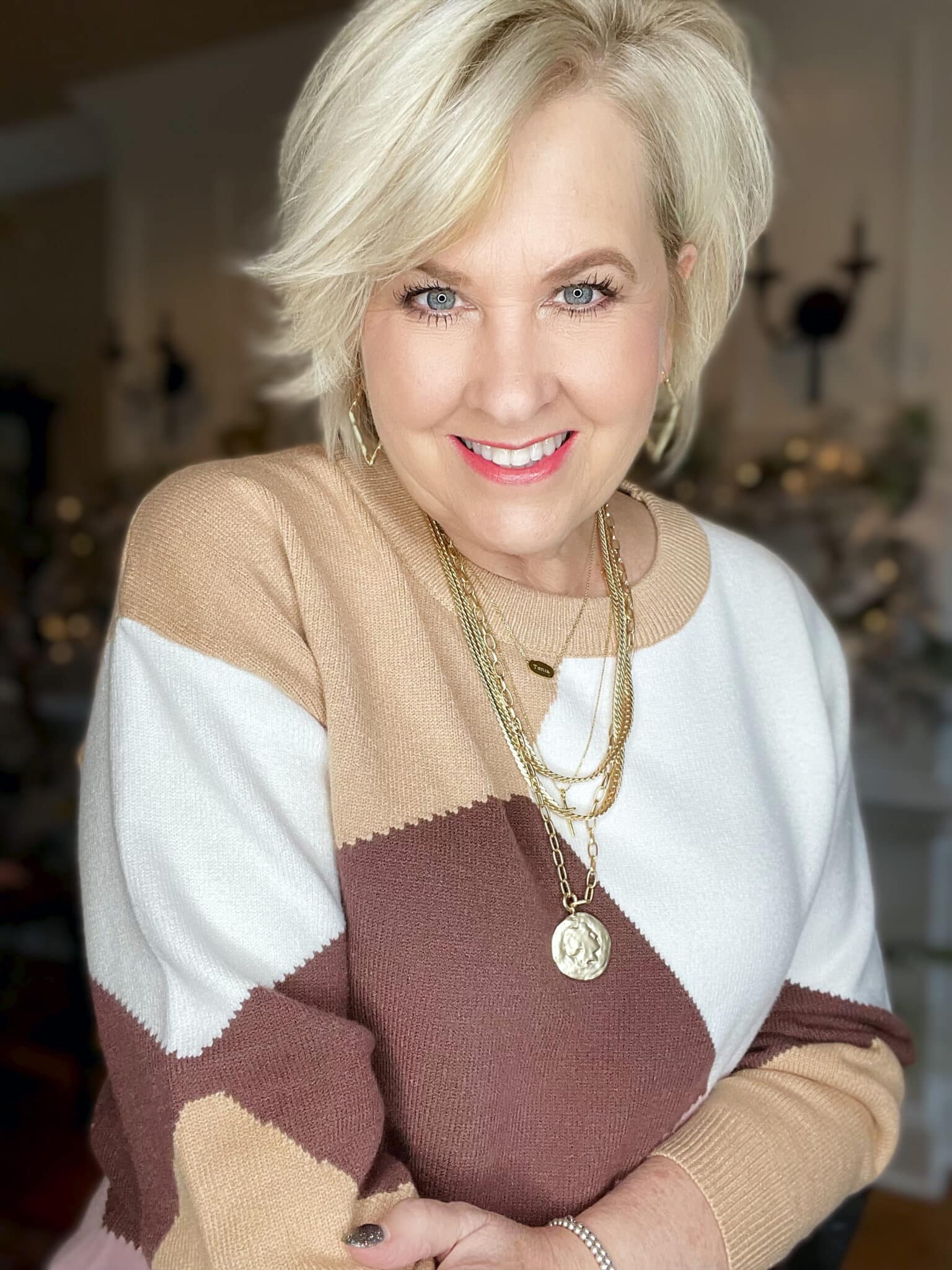 Over 40 Fashion Blogger, Tania Stephens is wearing a colorblock sweater