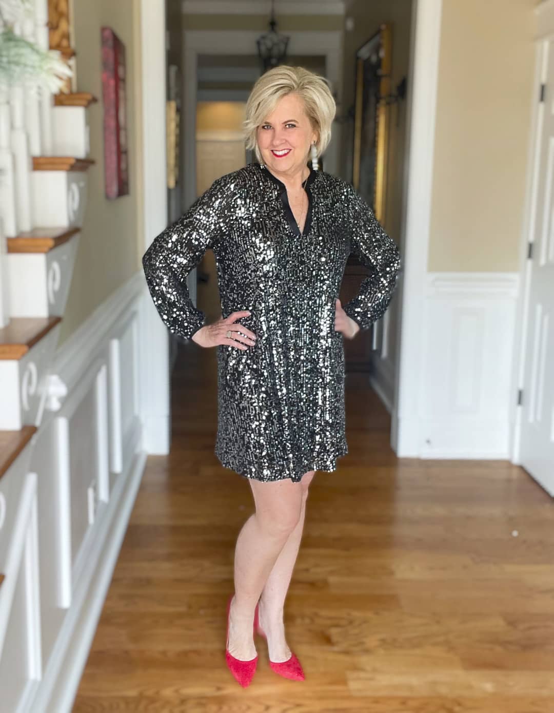 Over 40 Fashion Blogger, Tania Stephens is wearing a black sequined dress with red pumps for New Year's Eve