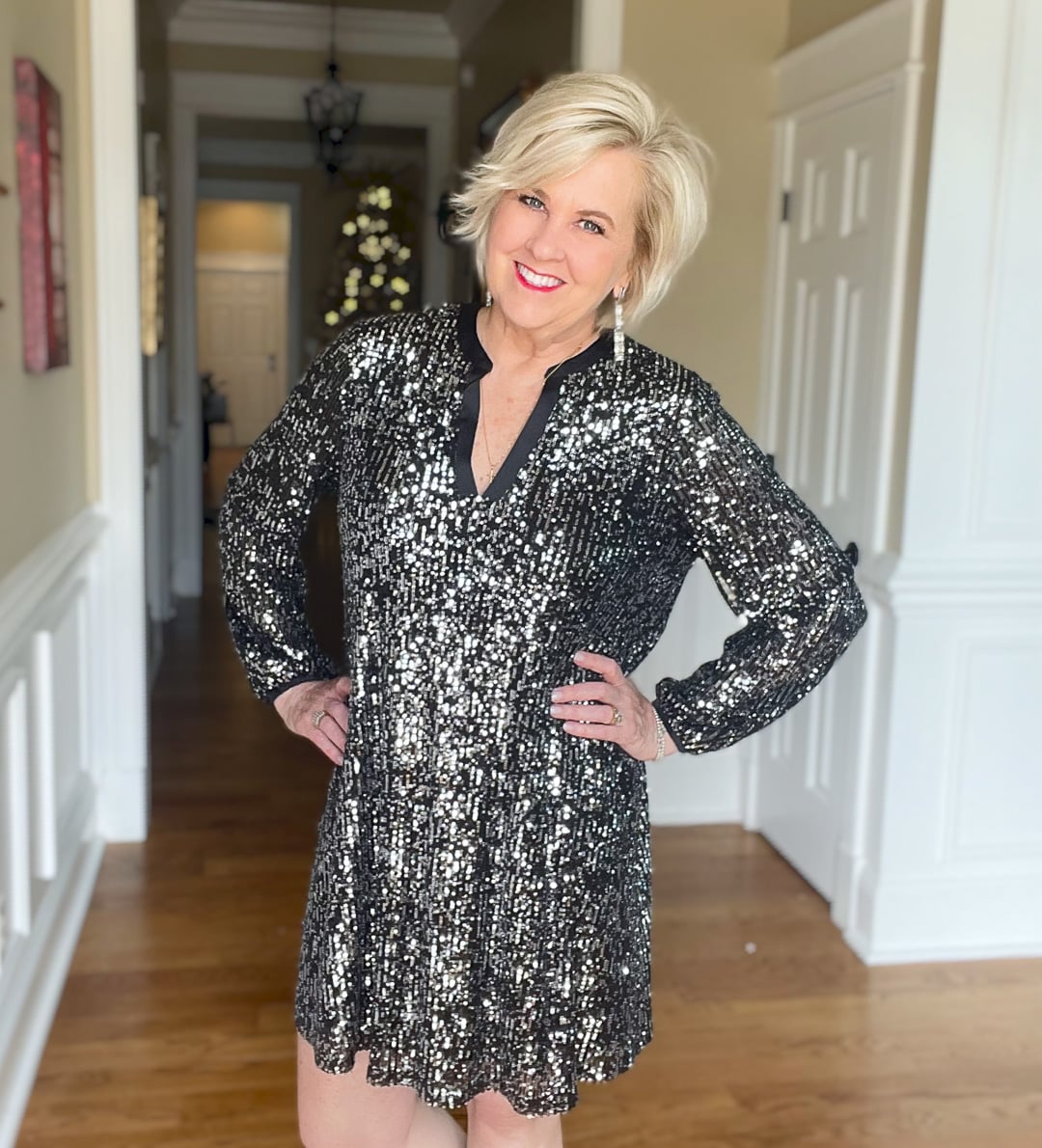 Over 40 Fashion Blogger, Tania Stephens is wearing a black sequined dress from Walmart for New Year's Eve