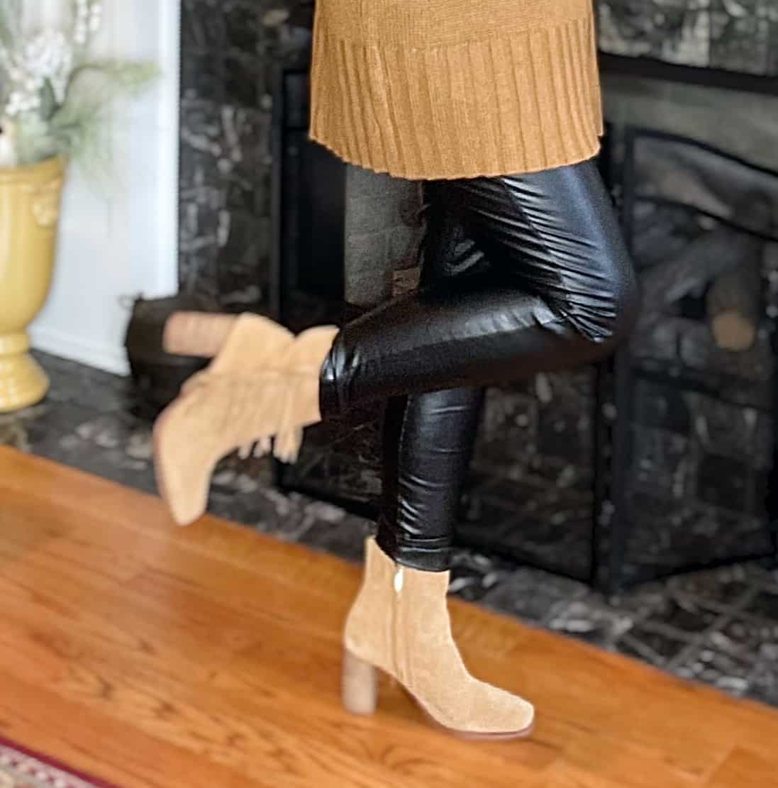 Over 40 Fashion Blogger, Tania Stephens is wearing A pair of faux leather leggings and ankle boots