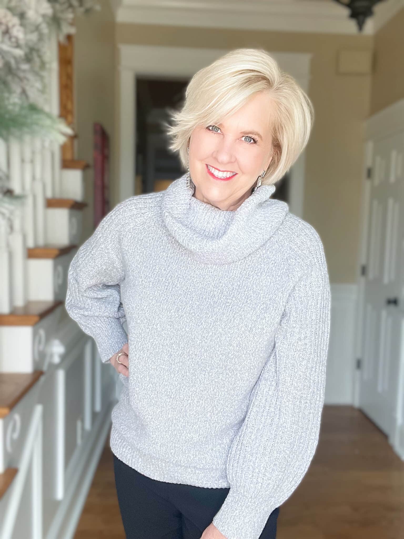 Over 40 Fashion Blogger, Tania Stephens is wearing a gray cowl neck sweater 