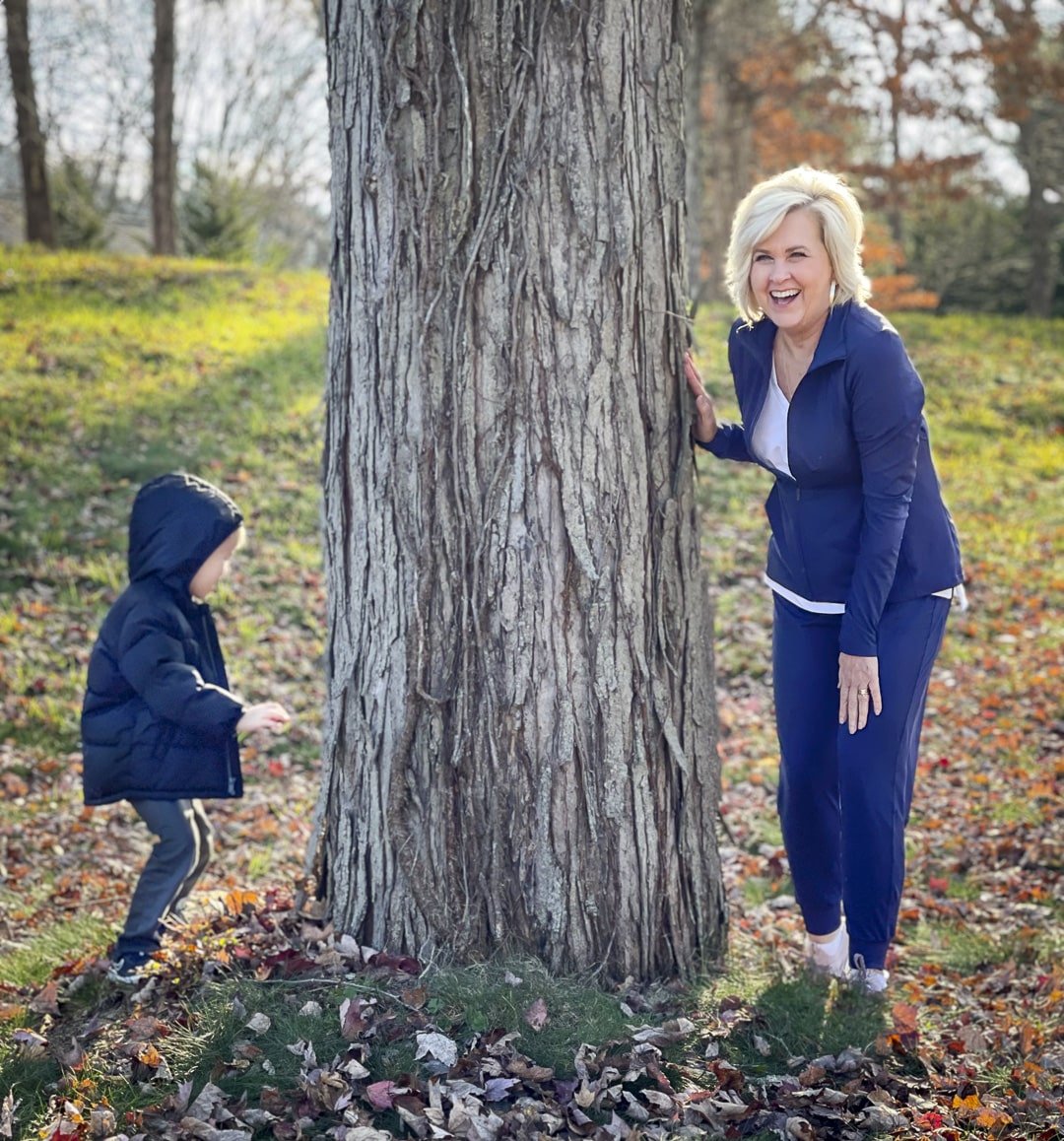 Over 40 Fashion Blogger, Tania Stephens is playing with her grandson in her Zella activewear 