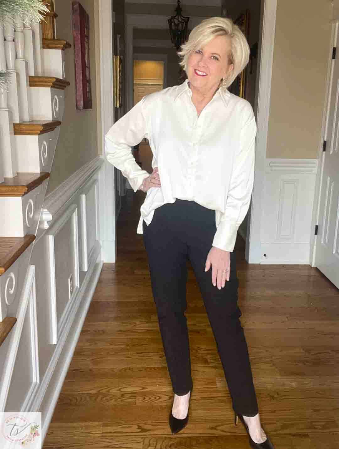 Over 40 Fashion Blogger, Tania Stephens is wearing a cream satin shirt from Target with black ankle pants and black pumps