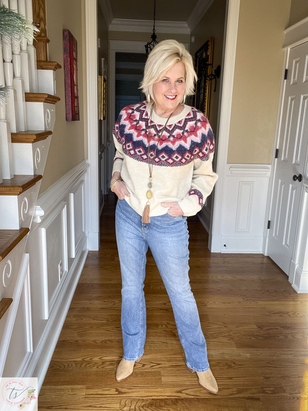 Over 40 Fashion Blogger, Tania Stephens is wearing a fairisle sweater and jeans look with pointy toe boots