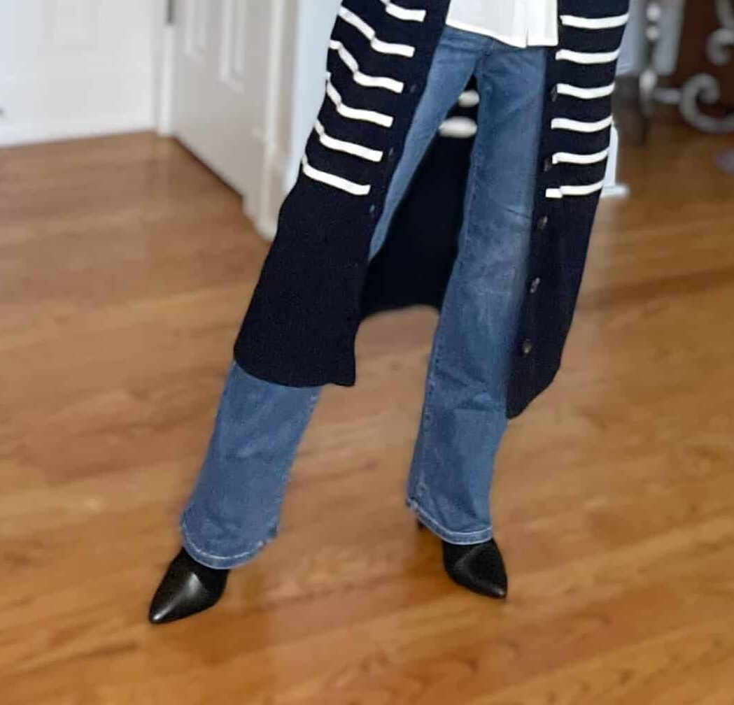Over 40 Fashion Blogger, Tania Stephens is wearing bootcut jeans and black boots