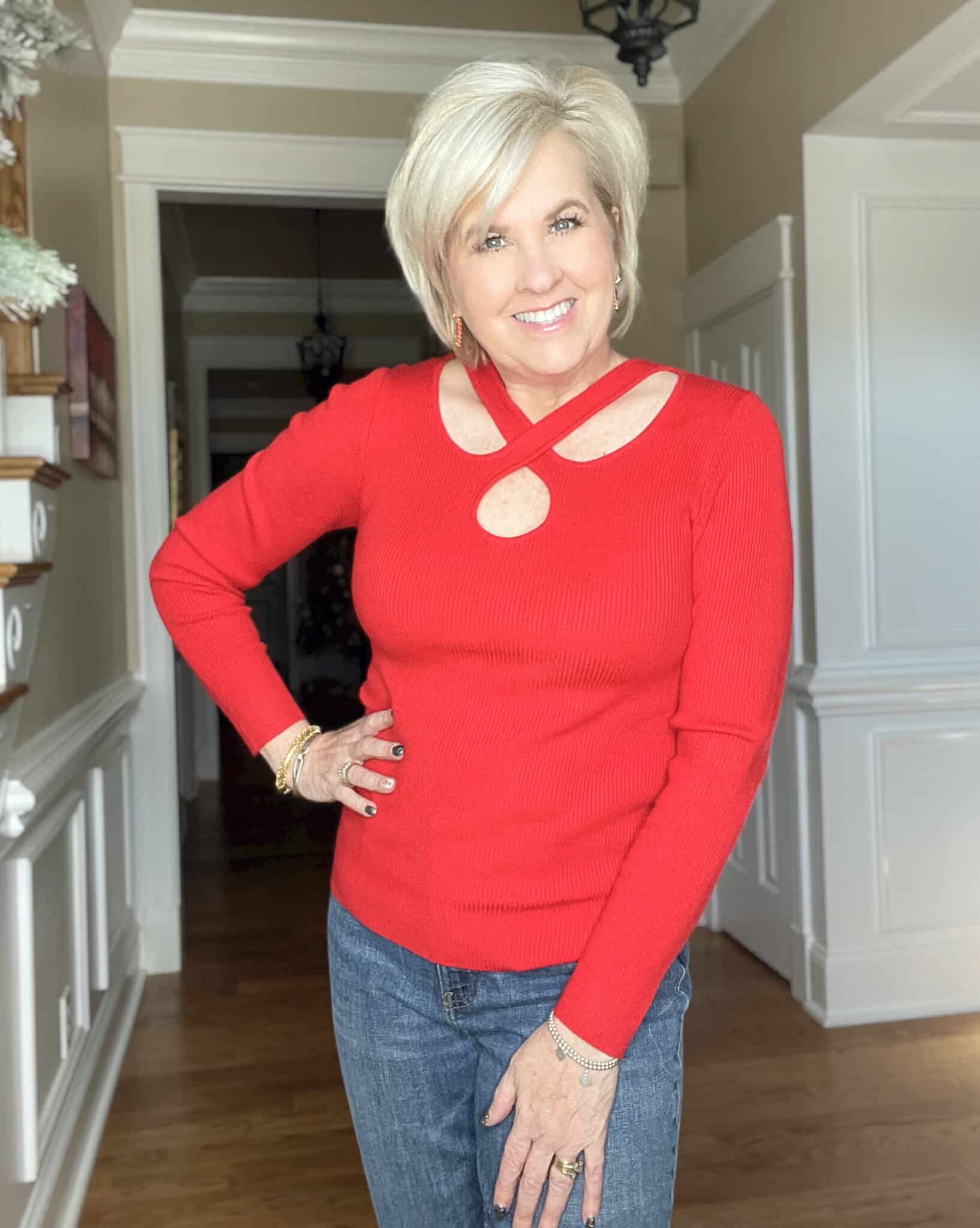 Over 40 Fashion Blogger, Tania Stephens is wearing a red sweater