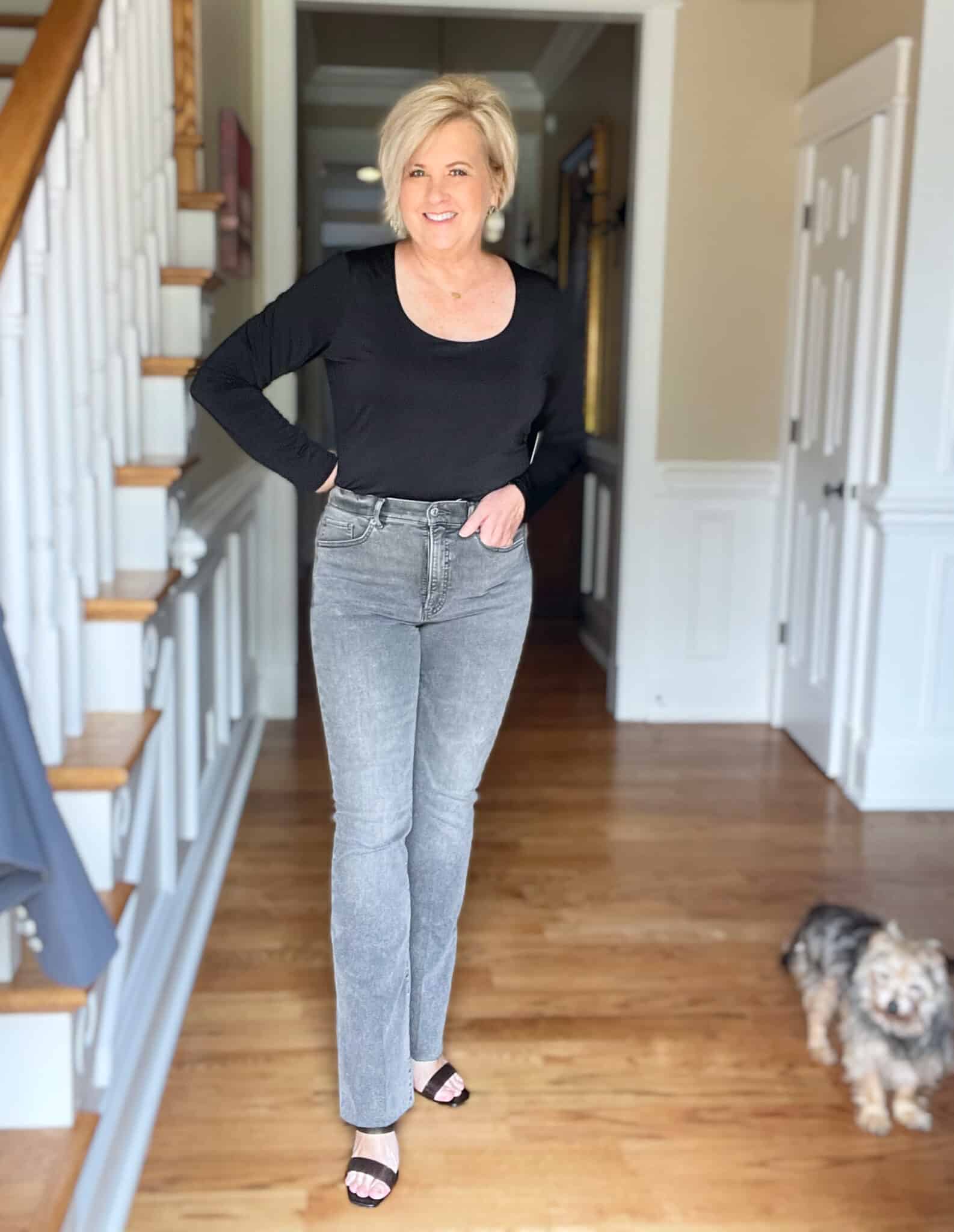 Black top with gray jeans