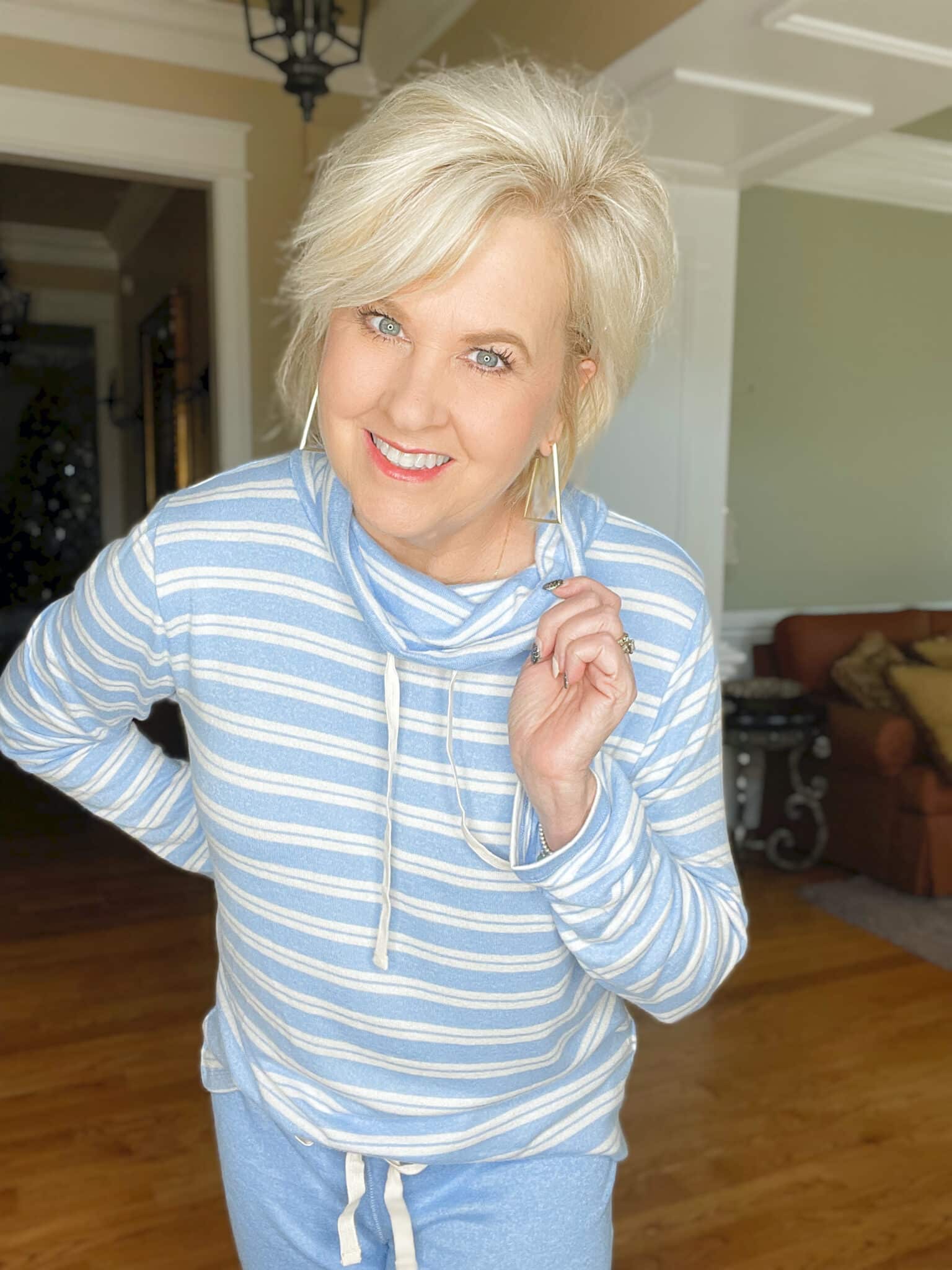 Over 40 Fashion Blogger, Tania Stephens is cozy in this blue and white striped top 
