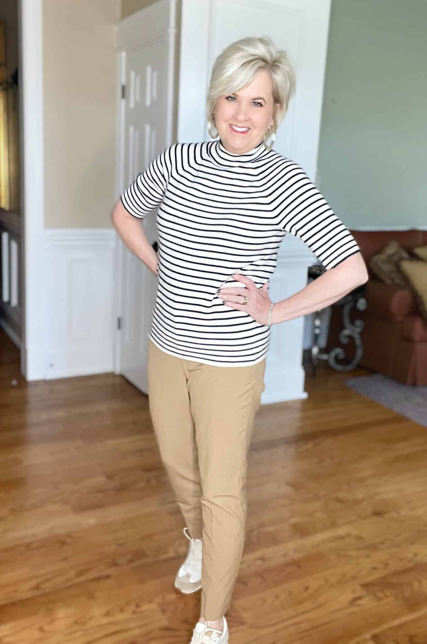 Over 40 Fashion Blogger, Tania Stephens is wearing a nautical sweater with camel pants