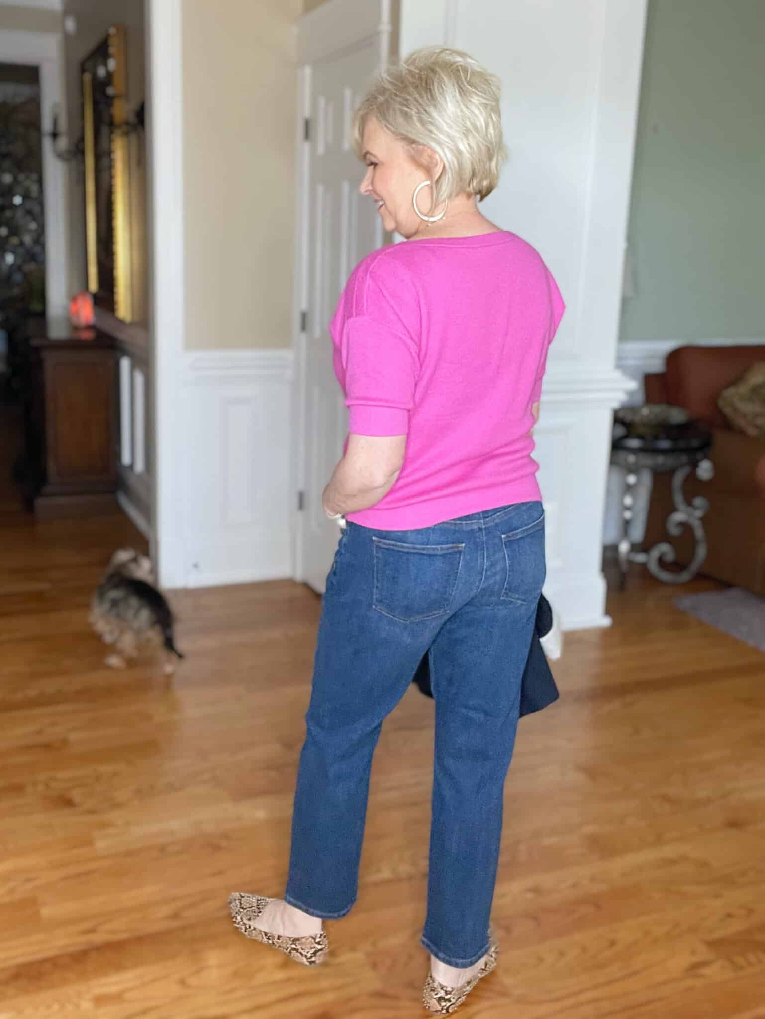 Over 40 Fashion Blogger, Tania Stephens is wearing a pin boatneck sweater and jeans