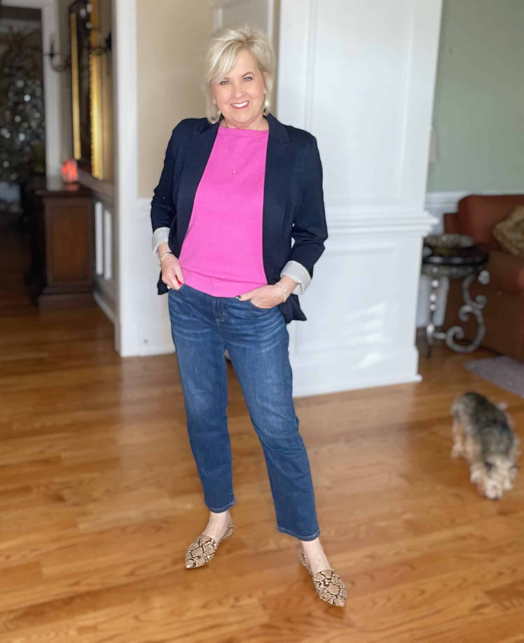 Over 40 Fashion Blogger, Tania Stephens is wearing a pin boatneck sweter, straight leg jeans, and a navy blazer