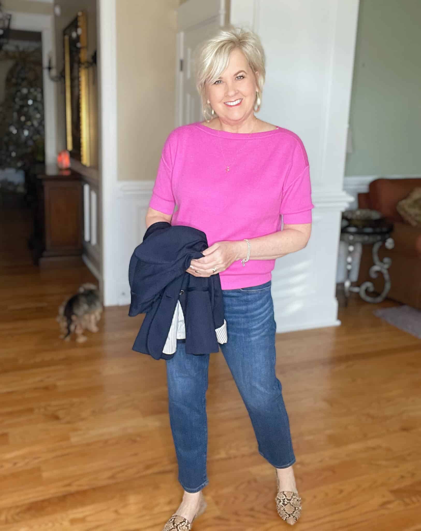 Over 40 Fashion Blogger, Tania Stephens is wearing a pin boatneck sweater and straight leg jeans from Ann Taylor