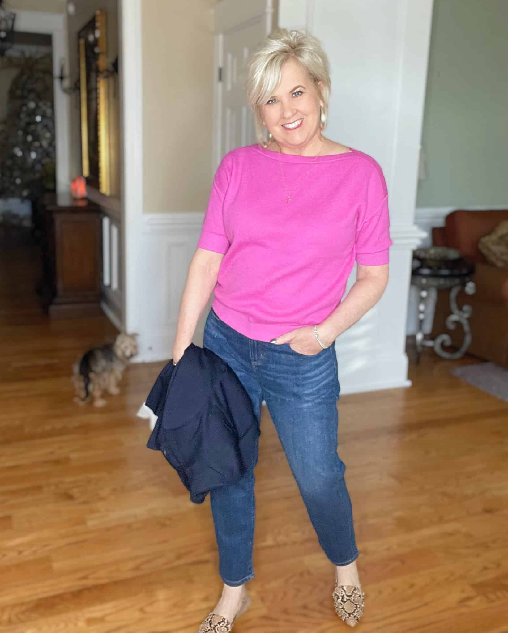 Over 40 Fashion Blogger, Tania Stephens is wearing a pin boatneck sweater and straight leg jeans
