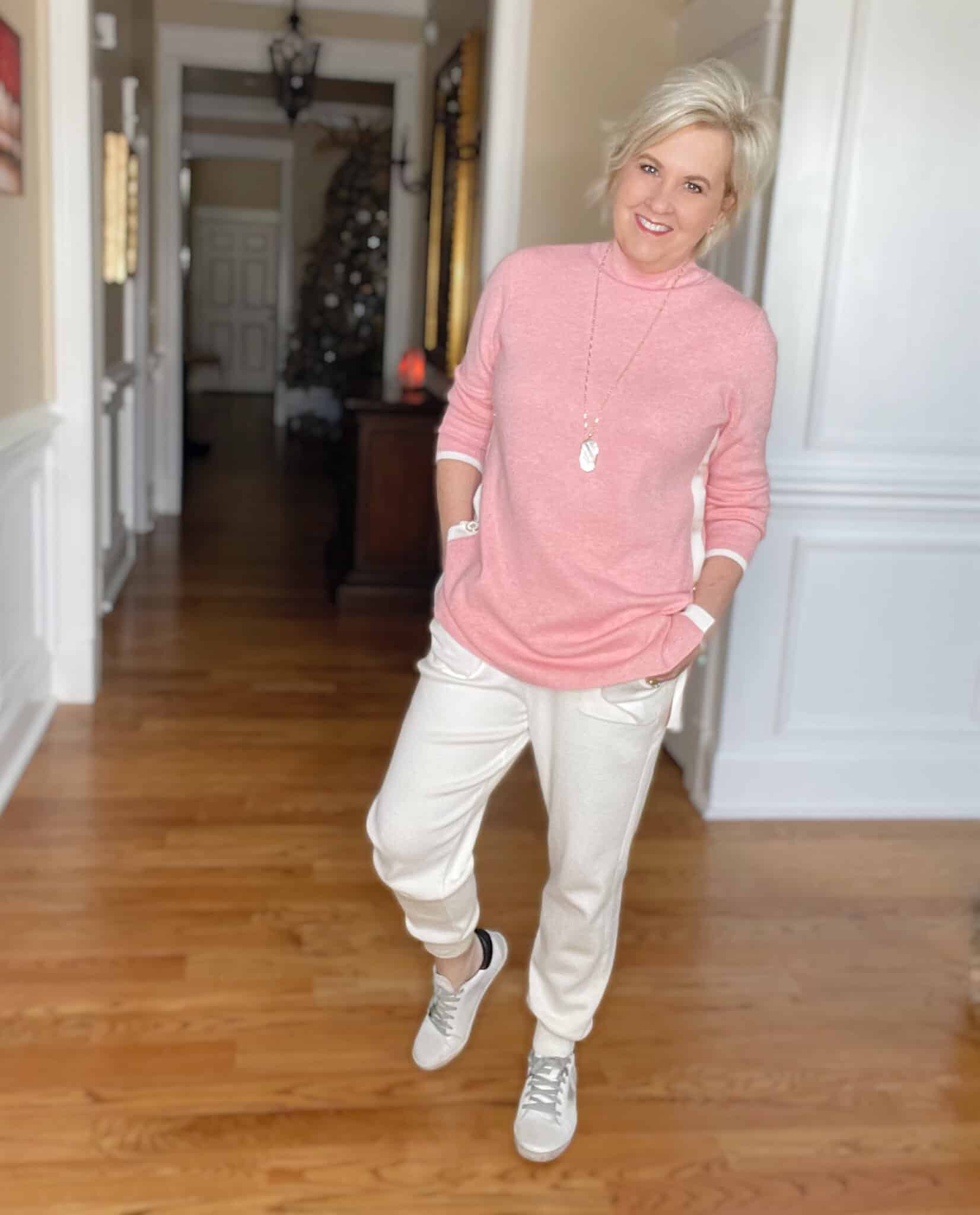 Over 40 Fashion Blogger, Tania Stephens is ready for the weekend in this pink sweater tunic and white cashmere blend joggers