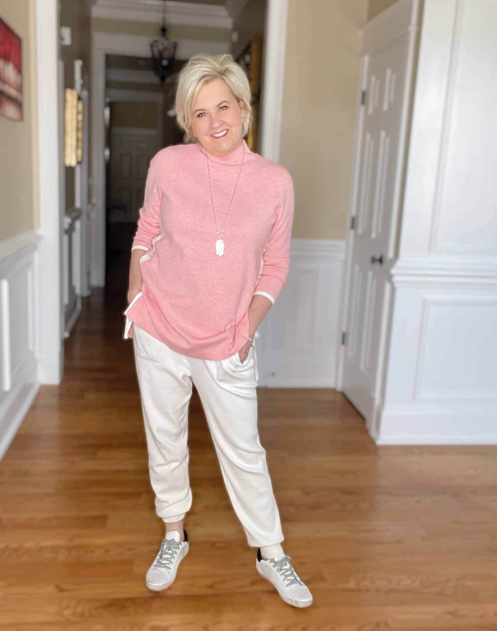 Over 40 Fashion Blogger, Tania Stephens is ready for the weekend in this pink sweater tunic and white cashmere blend joggers from Chicos
