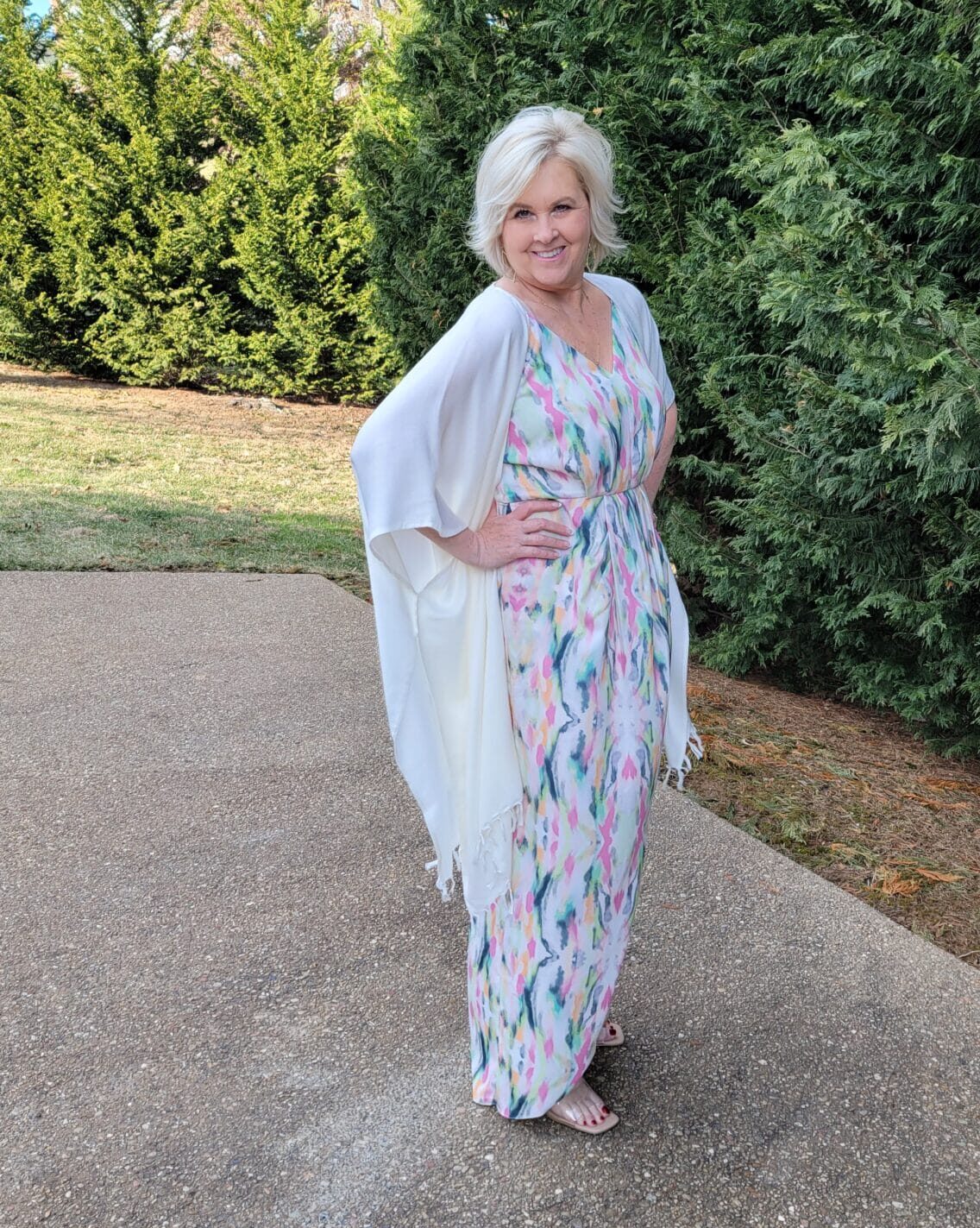 Over 40 Fashion Blogger, Tania Stephens is looking romantic in this multi-color dress and white wrap with nude heels from Nordstrom