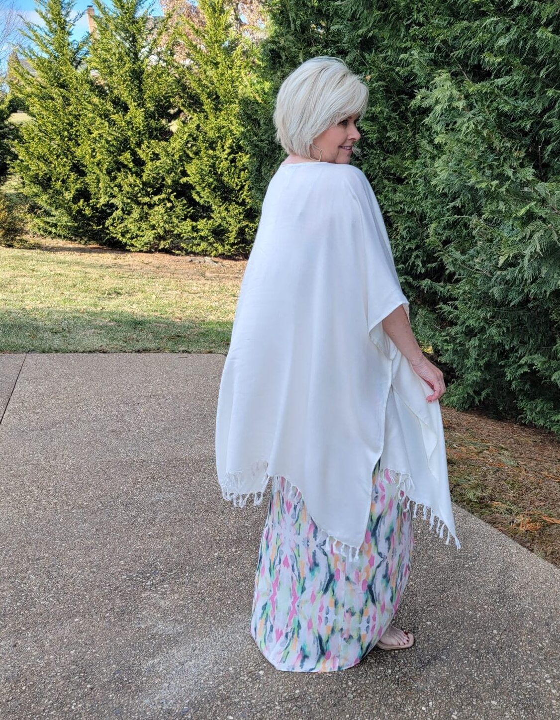 Over 40 Fashion Blogger, Tania Stephens is looking romantic in this multi-color dress and white wrap from Nordstrom