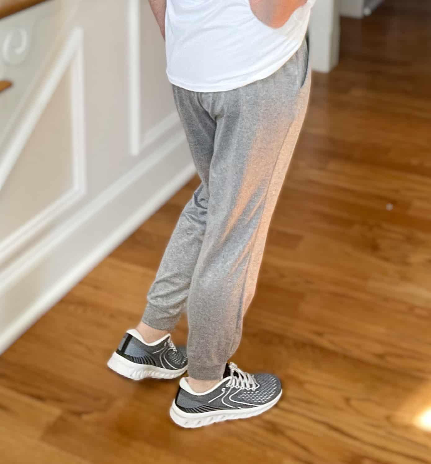 Over 40 Fashion Blogger, Tania Stephens is wearing gray joggers and gray sneakers