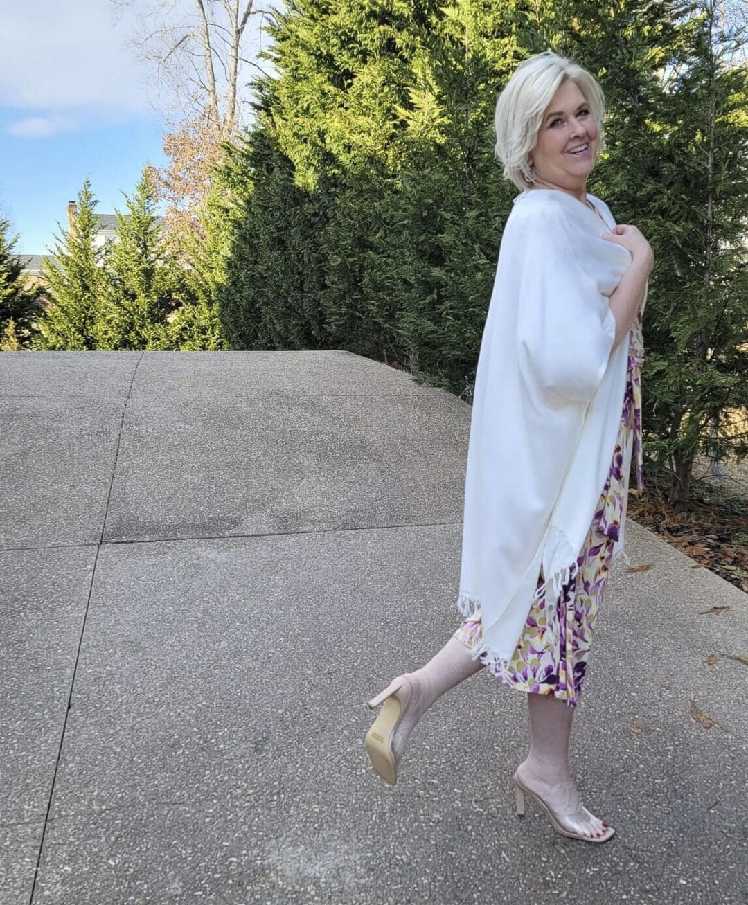 Over 40 Fashion Blogger, Tania Stephens is looking romantic in this floral dress and white wrap and nude heels from Nordstrom