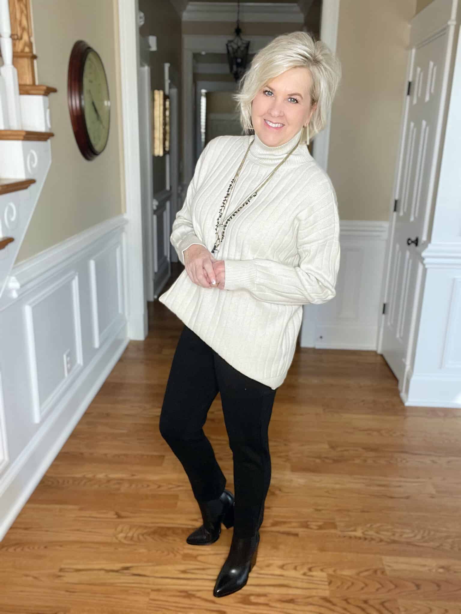 Over 40 Fashion Blogger, Tania Stephens is wearing an ivory oversized sweater with Spanx black perfect pants