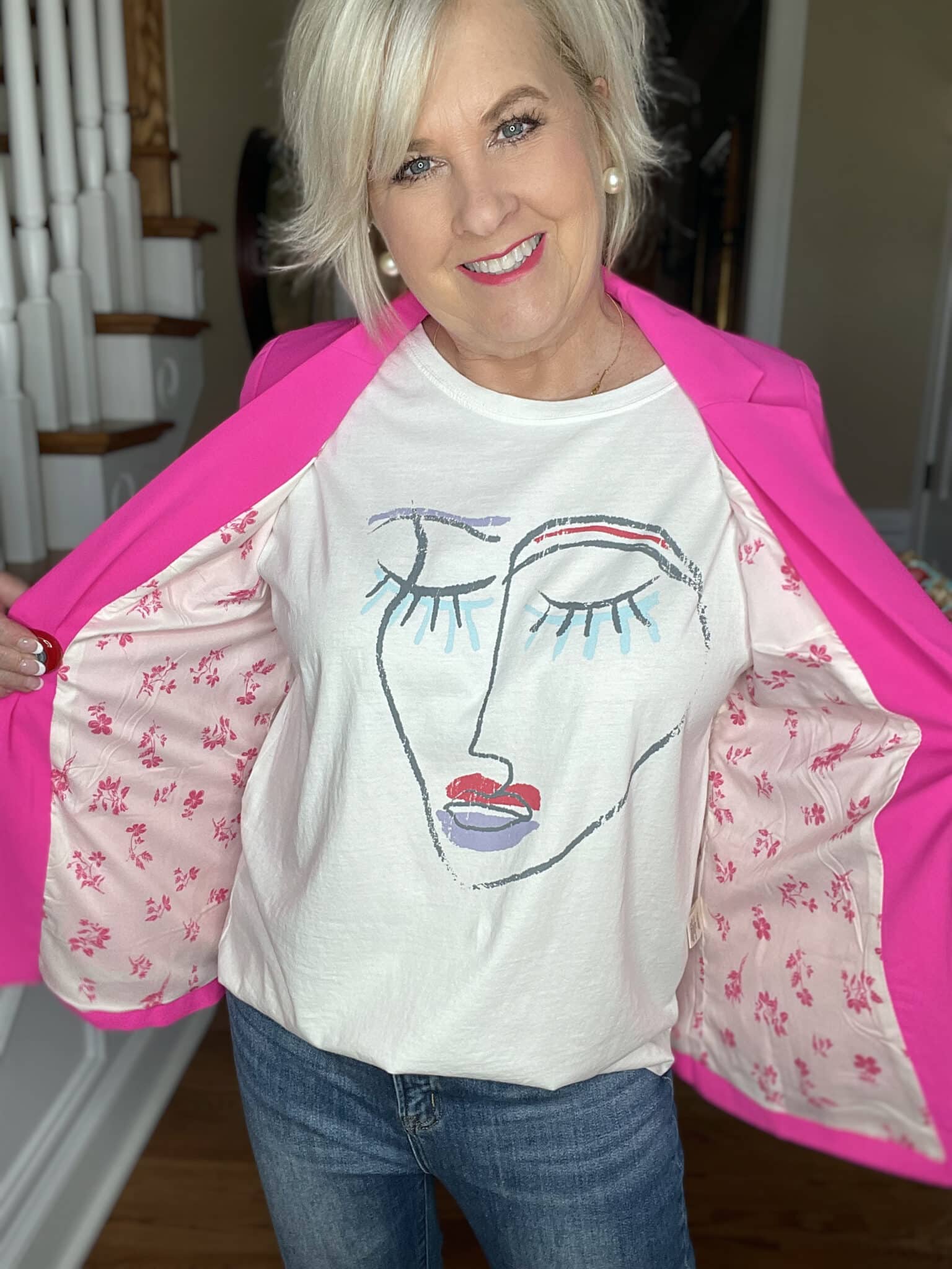Over 40 Fashion Blogger, Tania Stephens is wearing a pink blazer with a graphic tee