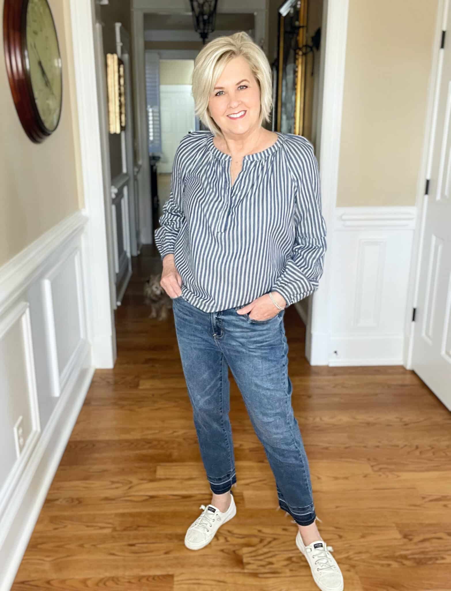 Over 40 Fashion Blogger, Tania Stephens is styling a pair of released hem jeans with Sperry sneakers and a striped shirt