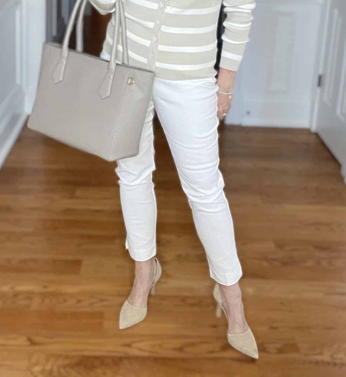 Over 40 Fashion Blogger, Tania Stephens is wearing an Ecru pair of pants from Chicos