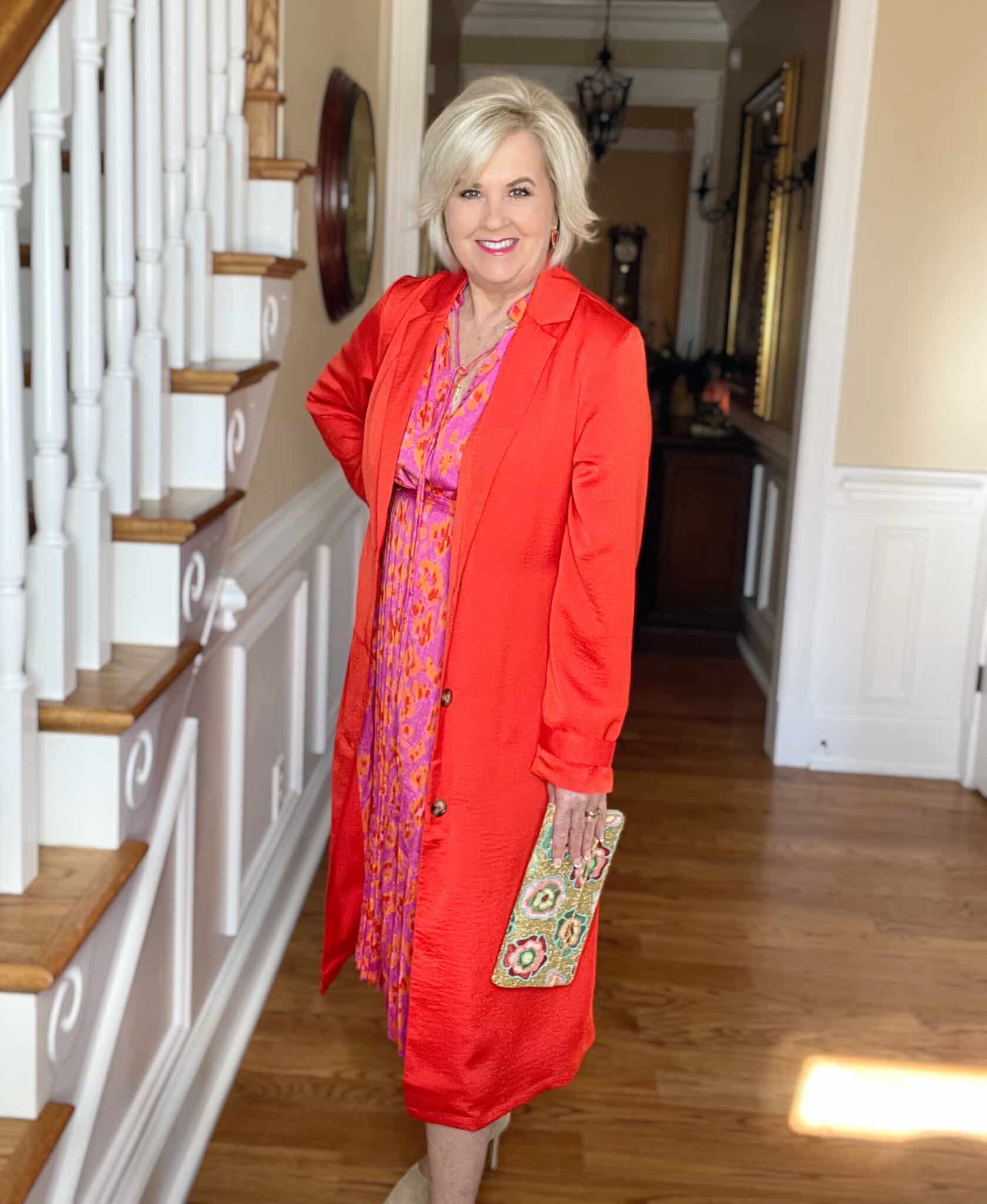 Over 40 Fashion Blogger, Tania Stephens is ready for spring in this floral pink and red dress and red trench coat from Walmart