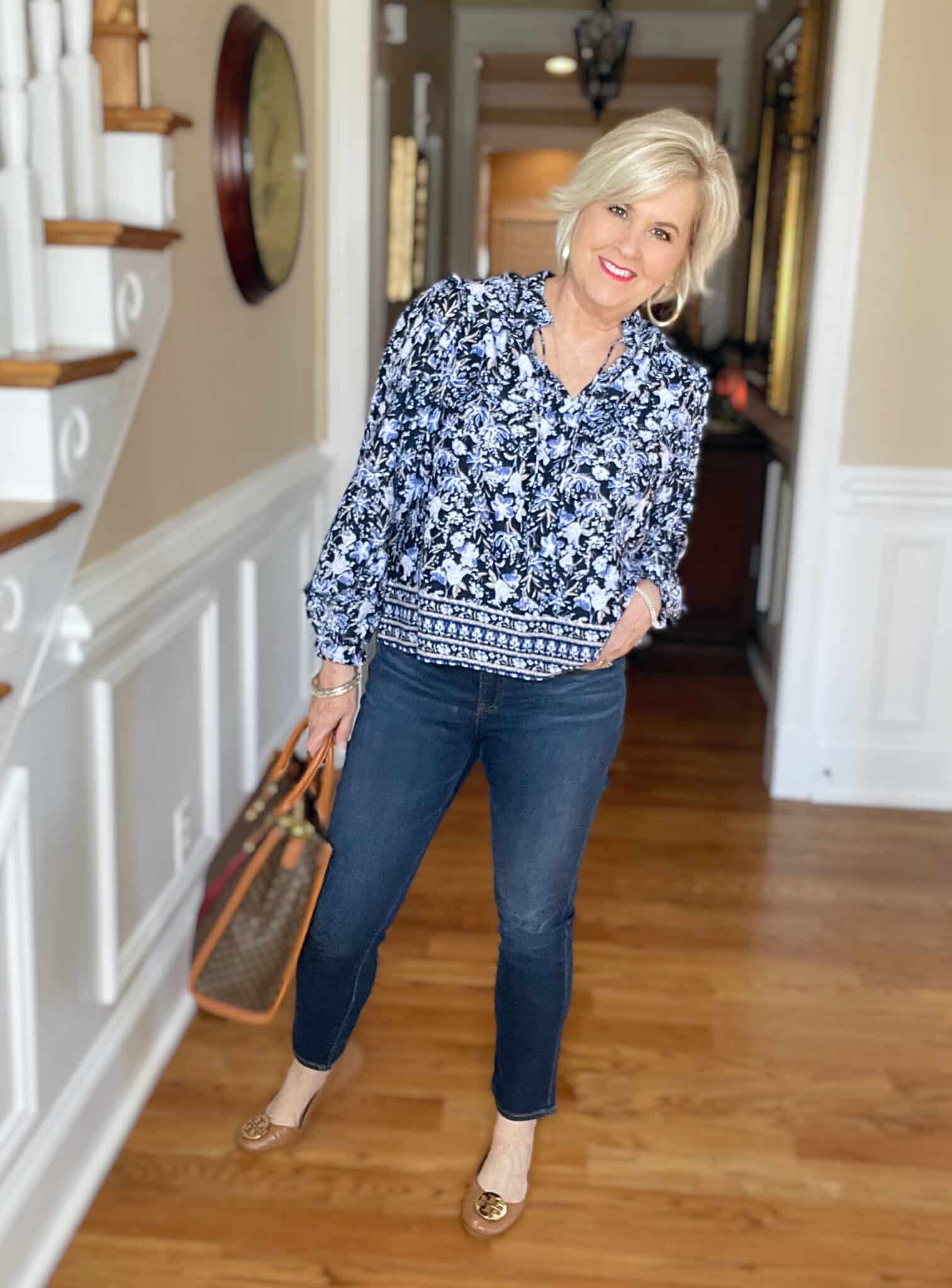Over 40 Fashion Blogger, Tania Stephens is wearing a blue floral top from Walmart and jeggings from Chicos 1