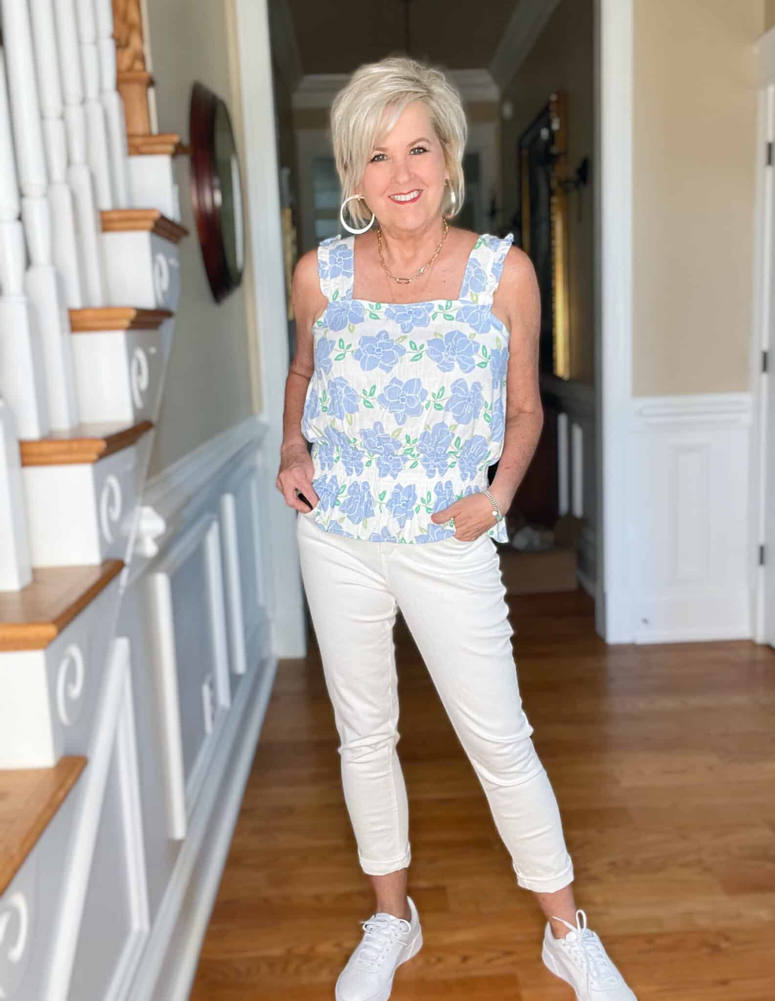 Over 40 Fashion Blogger, Tania Stephens is wearing a Kohl's top, a denim jacket, white jeans, and white sneakers 11