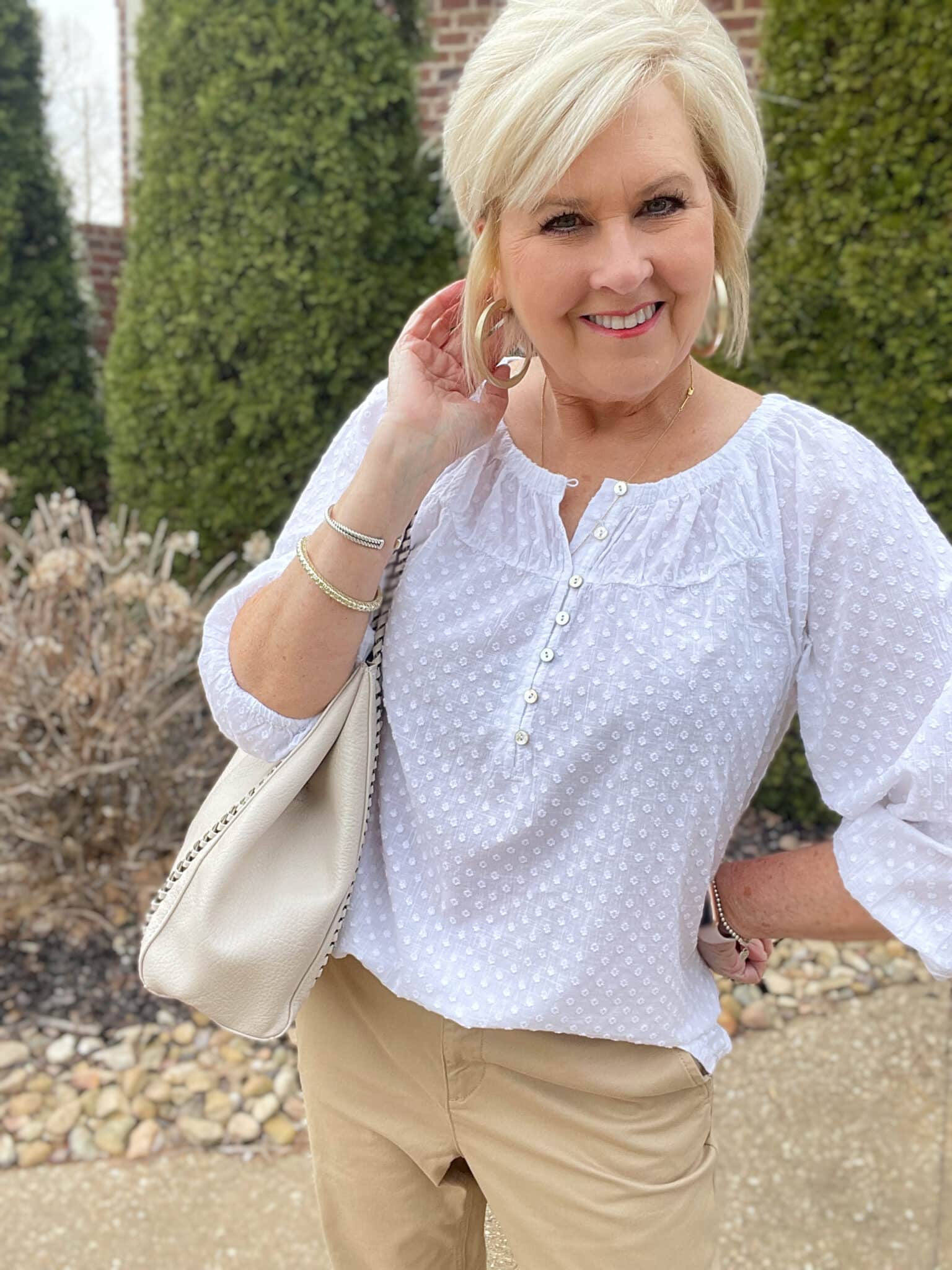 Over 40 Fashion Blogger, Tania Stephens is styling a white henley blouse