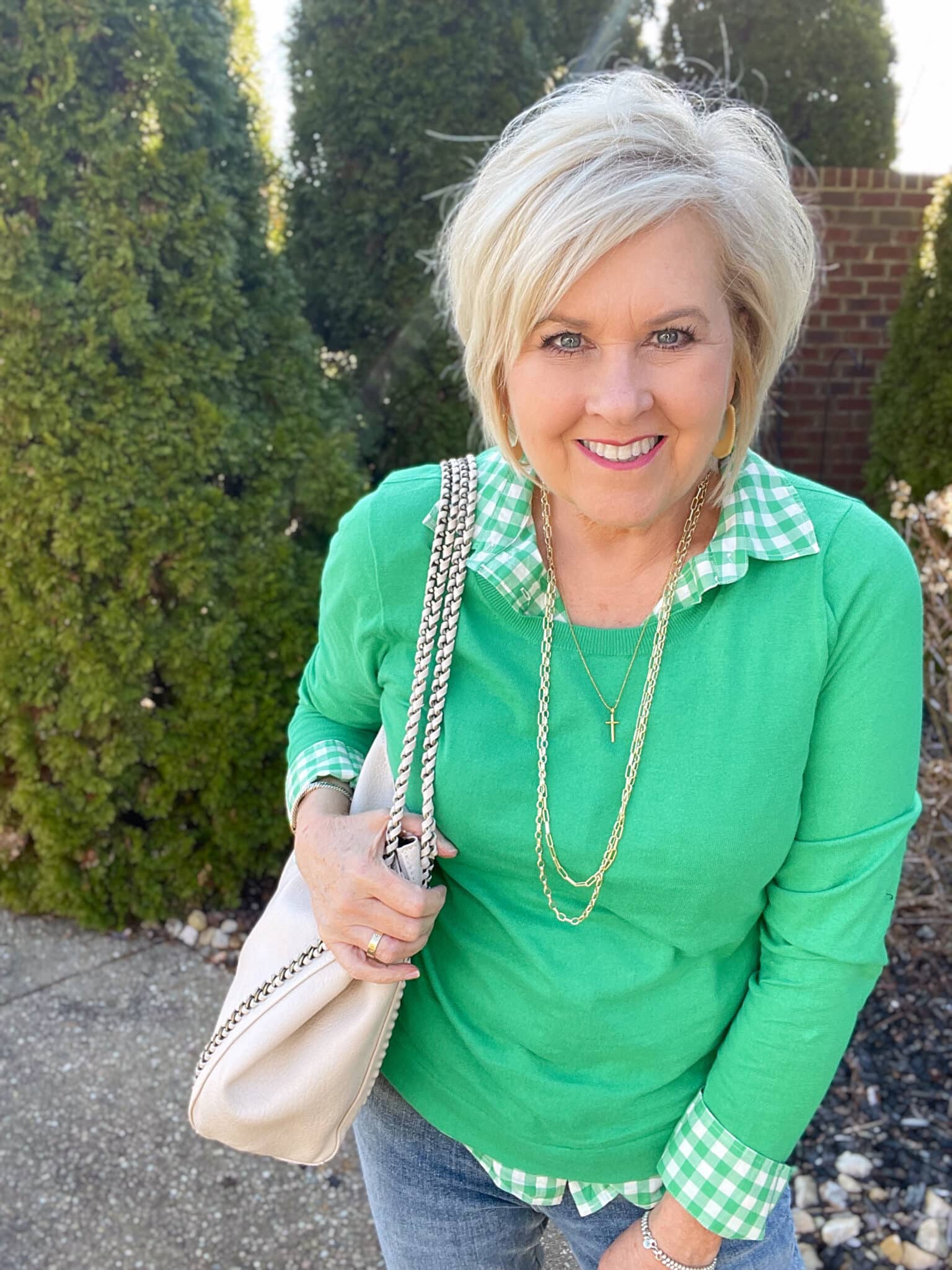 Over 40 Fashion Blogger, Tania Stephens is styling a green gingham shirt and a green sweater