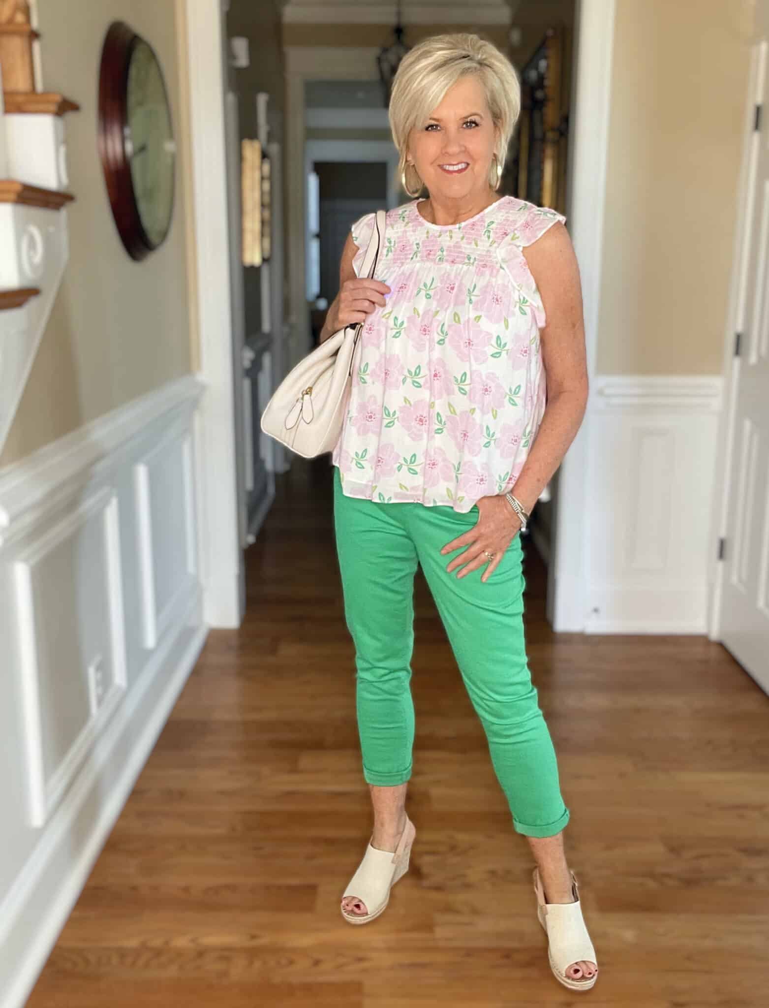 Over 40 Fashion Blogger, Tania Stephens is wearing a feminine pink top with green pants from Kohl's 19