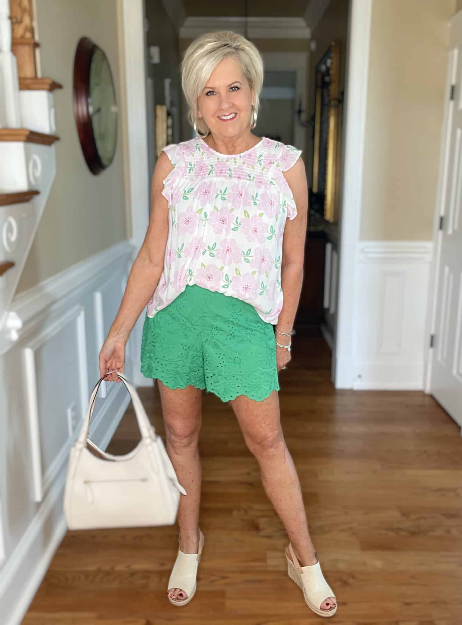 Over 40 Fashion Blogger, Tania Stephens is wearing a feminine pink top with green pants from Kohl's21