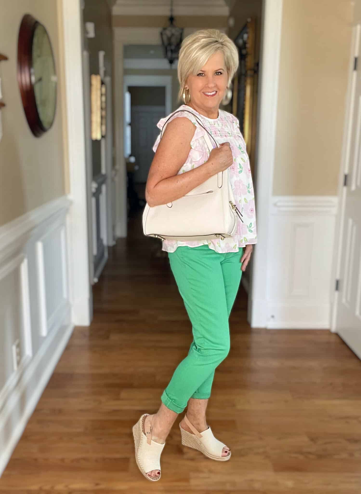 Over 40 Fashion Blogger, Tania Stephens is wearing a feminine pink top with green pants from Kohl's7