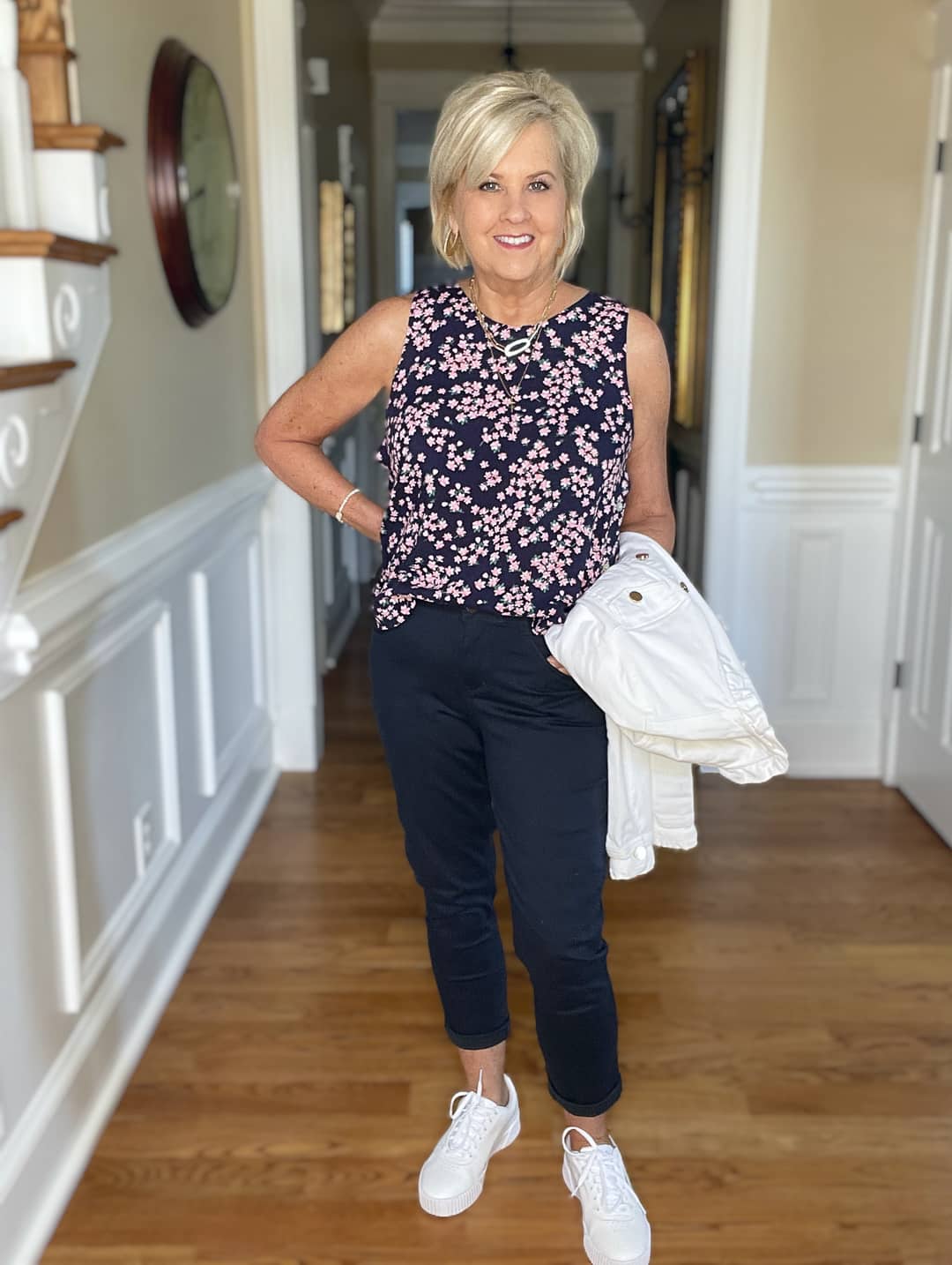Over 40 Fashion Blogger, Tania Stephens is wearing navy crop pants, a printed top, and a white denim jacket 9