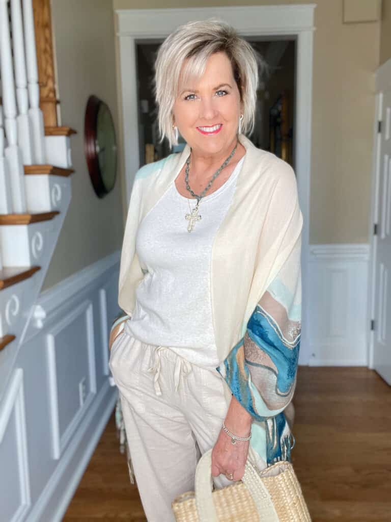 Over 40 Fashion Blogger, Tania Stephens is wearing linen pants and a tank top with a beautiful scarf 18